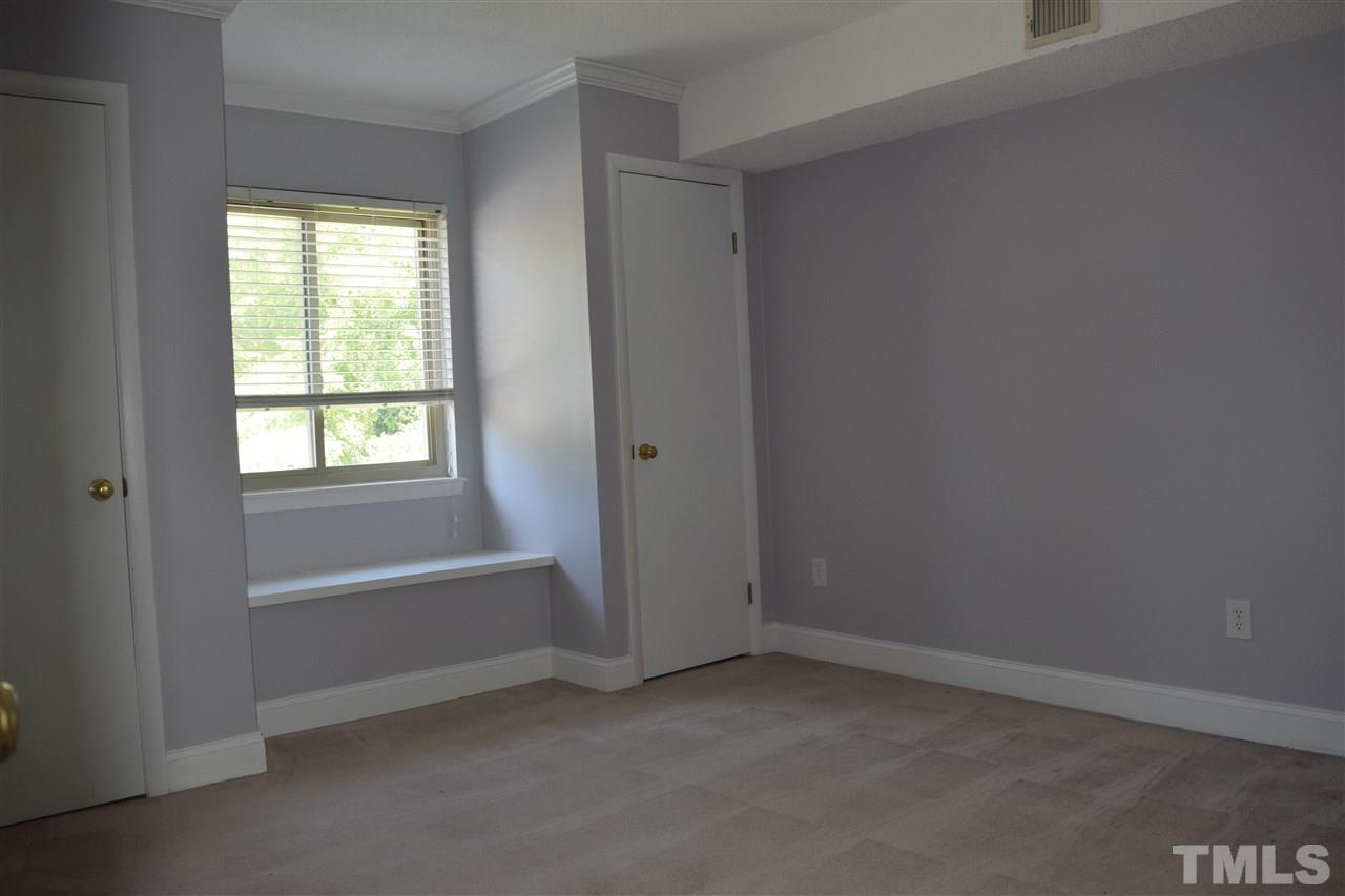4519 Edwards Mill Road, Unit F Raleigh, NC 27612 - Photo 7 of 14 a view of an empty room with a window