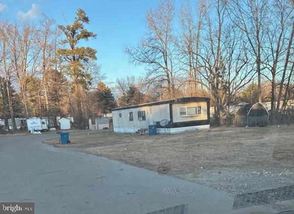 a view of a house with a yard and garage