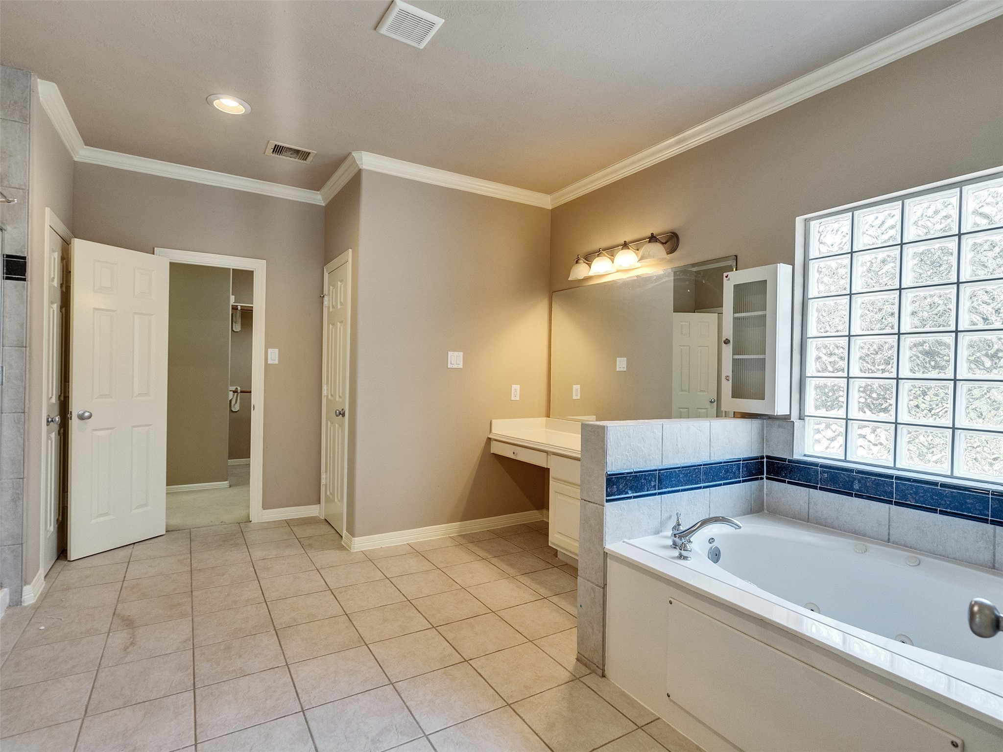 1502 Olive Place Houston, TX 77077 - Photo 22 of 35 a bathroom with a bathtub and a shower