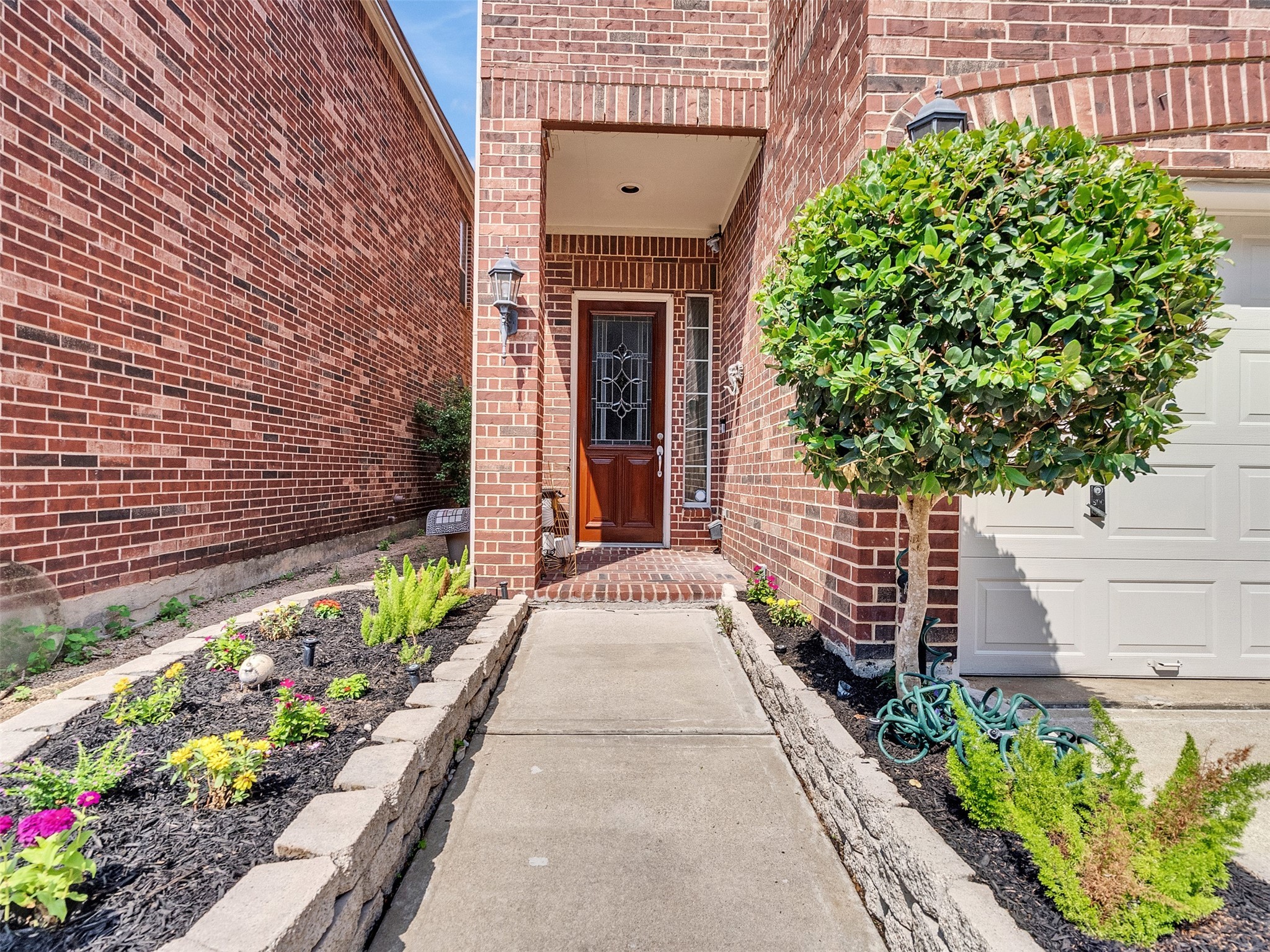1502 Olive Place Houston, TX 77077 - Photo 3 of 35 a entryway with flower pots