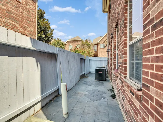 a view of a pathway along the building