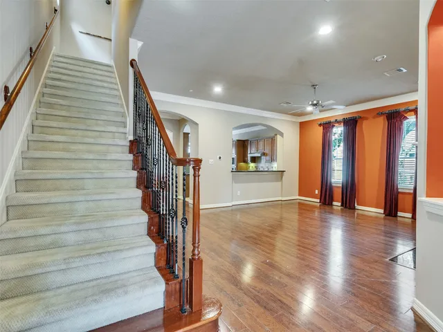 a view of an entryway with wooden floor