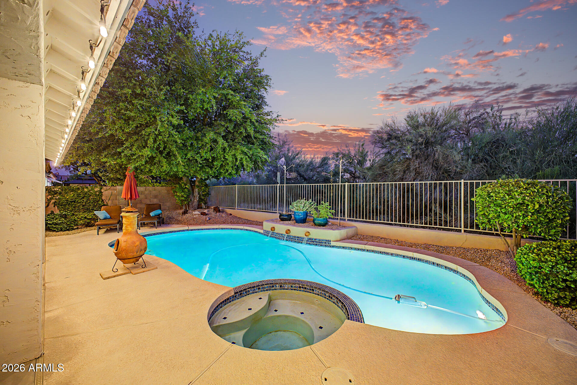 4309 East Rancho Caliente Drive Cave Creek, AZ 85331 - Photo 23 of 37 a view of a swimming pool with a patio and a yard