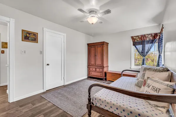 a bedroom with furniture and window