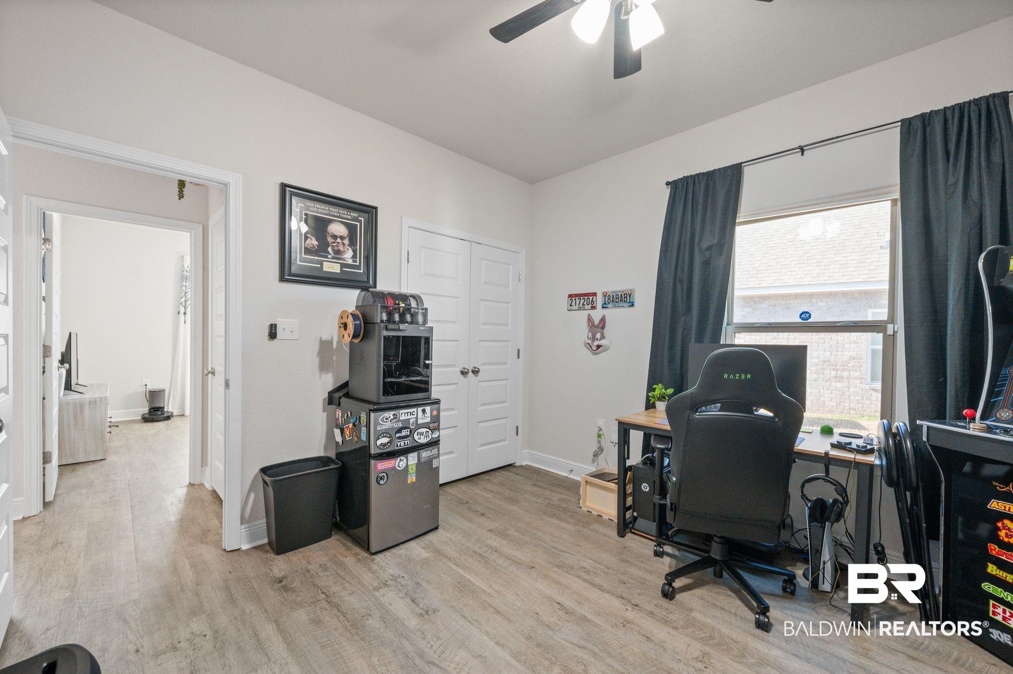 24891 Spectacular Bid Loop Daphne, AL 36526 - Photo 43 of 51 Office with ceiling fan and light wood-type flooring
