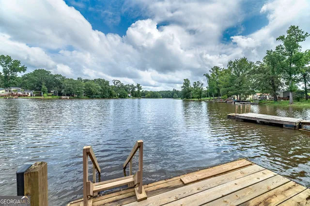 a lake view with sitting space and garden