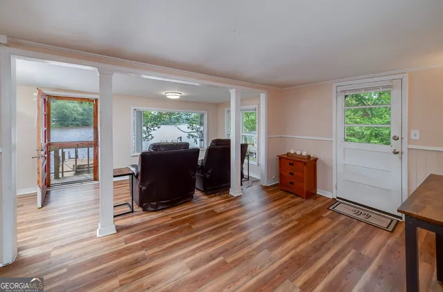 a view of a livingroom with furniture window and wooden floor