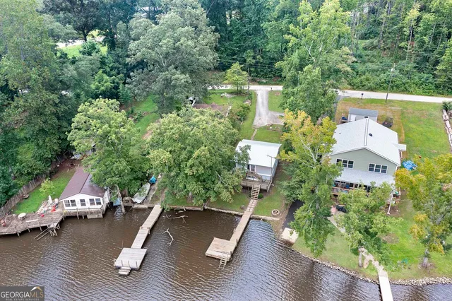 aerial view of a house with wooden floor and outdoor space