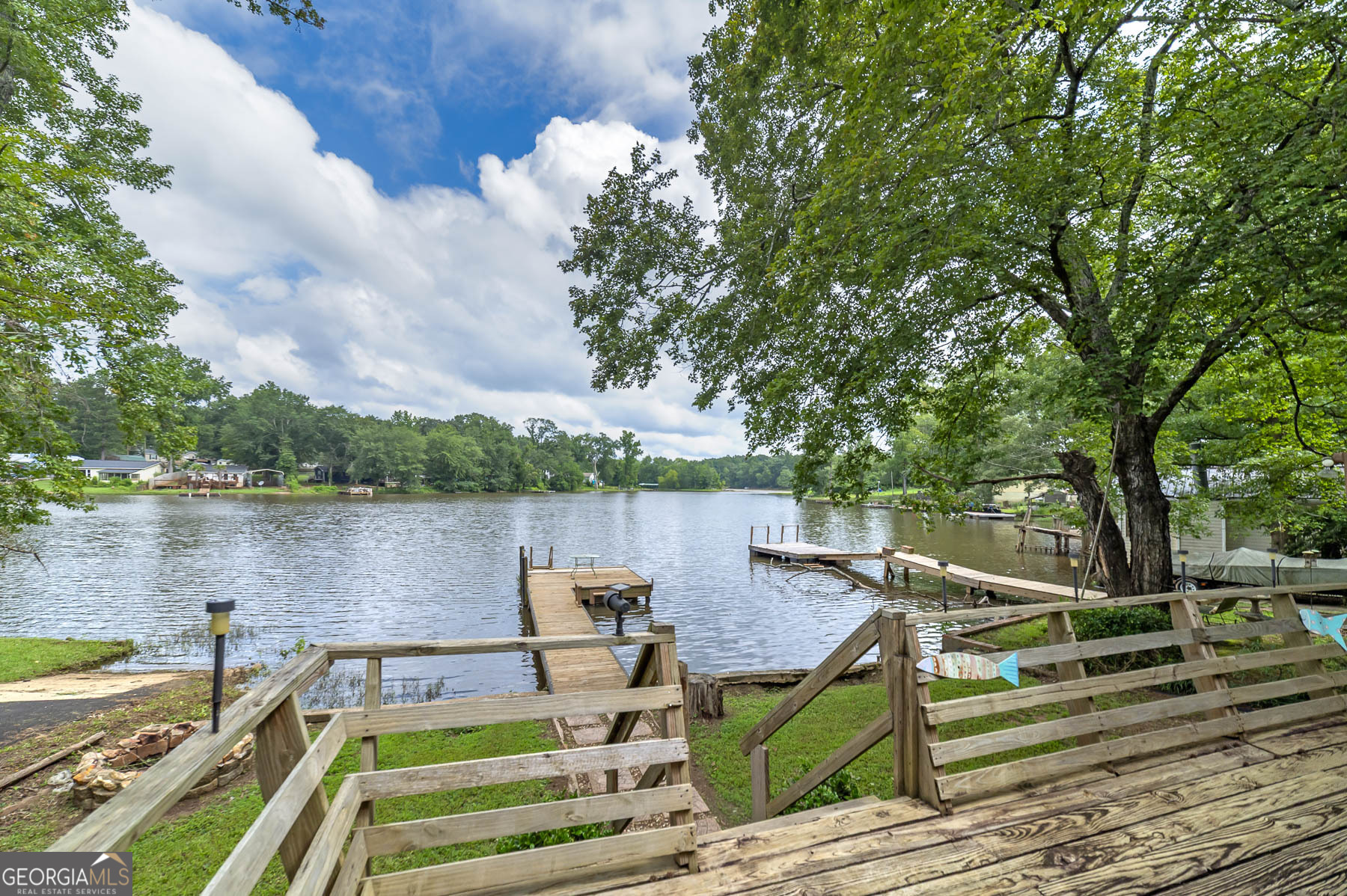 126 Elizabeth Circle Jackson, GA 30233 - Photo 28 of 33 a view of a lake with couches chairs and wooden floor