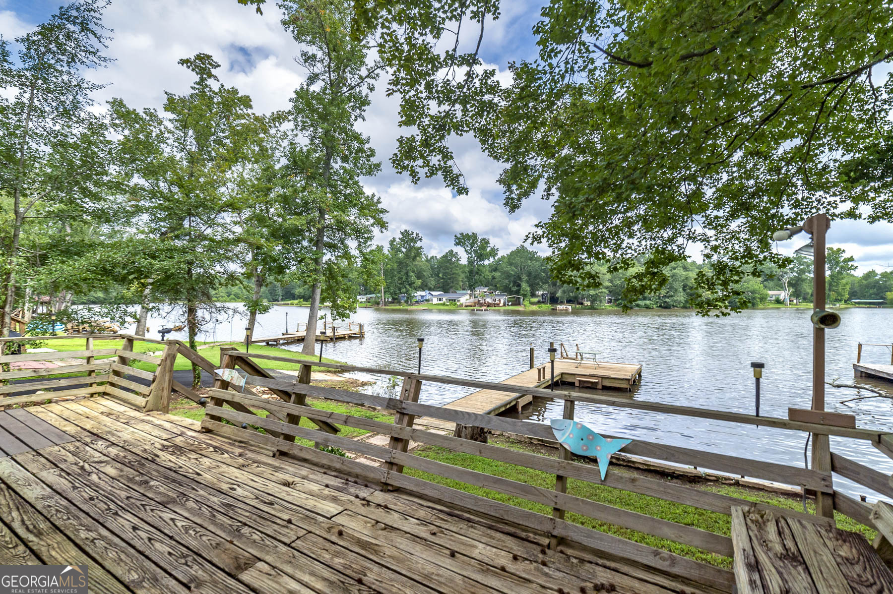 126 Elizabeth Circle Jackson, GA 30233 - Photo 29 of 33 a view of a lake with wooden deck and lake view