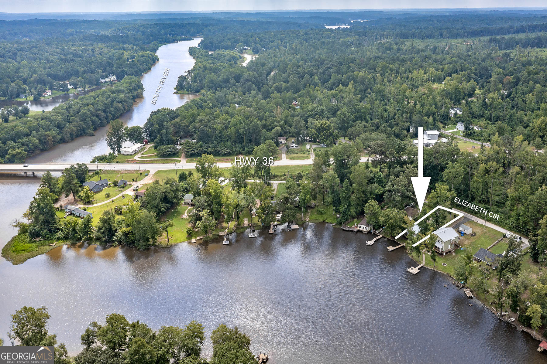 126 Elizabeth Circle Jackson, GA 30233 - Photo 3 of 33 an aerial view of a house with a yard and lake view