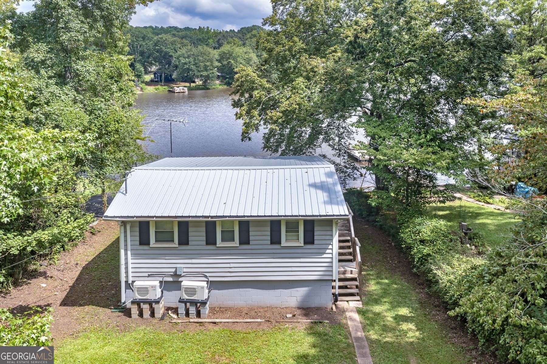 126 Elizabeth Circle Jackson, GA 30233 - Photo 8 of 33 a aerial view of a house with swimming pool next to a yard