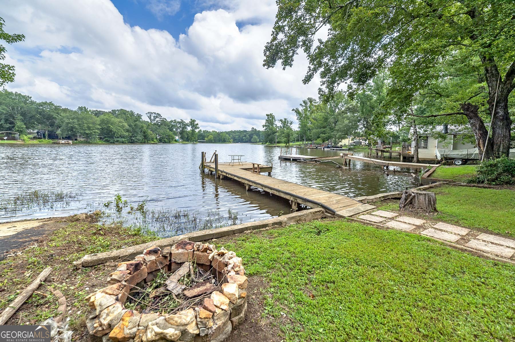 126 Elizabeth Circle Jackson, GA 30233 - Photo 10 of 33 a view of a lake with houses in the back