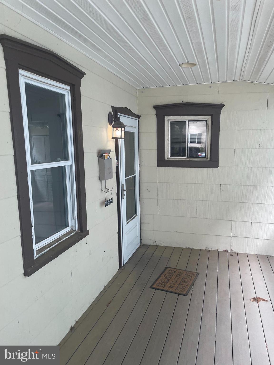 309 West Avenue Pitman, NJ 08071 - Photo 3 of 12 a view of a hallway with wooden floor and staircase