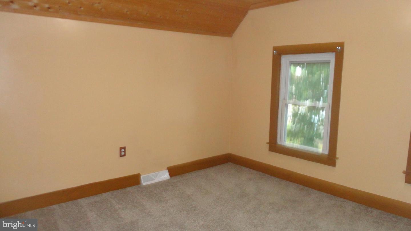 309 West Avenue Pitman, NJ 08071 - Photo 8 of 12 a view of a small space with wooden floor and a window