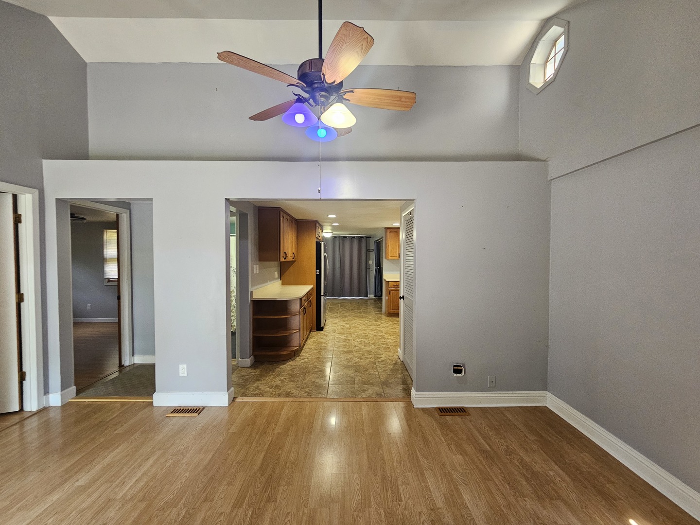 10N827 Hawthorne Street Elgin, IL 60123 - Photo 4 of 14 wooden floor in an empty room with a window