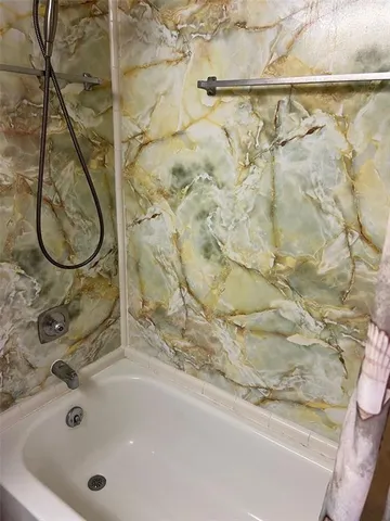 a bathroom with a bath tub