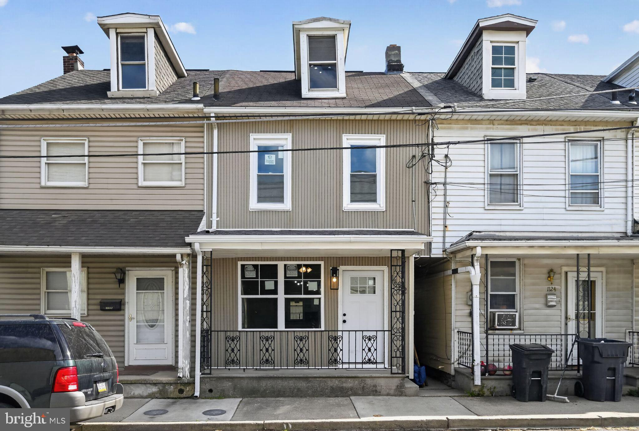 Charming row home with inviting facade.