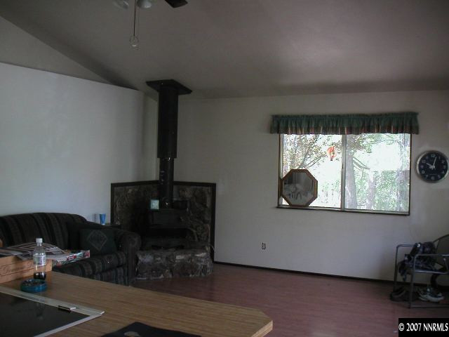 2255 Piute Creek Road Reno, NV 89510 - Photo 3 of 9 a living room with furniture and a fireplace