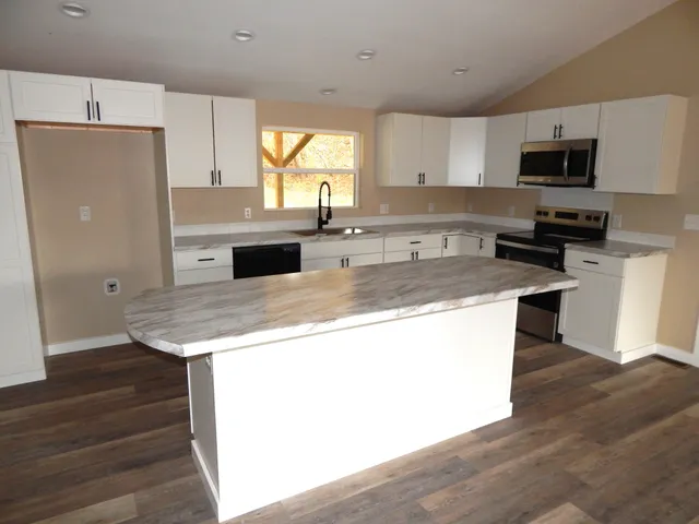 a white toilet sitting next to a bathroom sink
