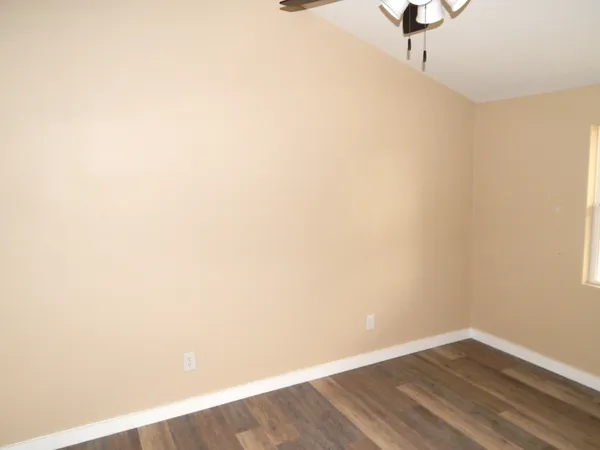 a view of a small space with wooden floor