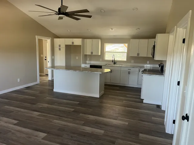a view of a small space with wooden floor