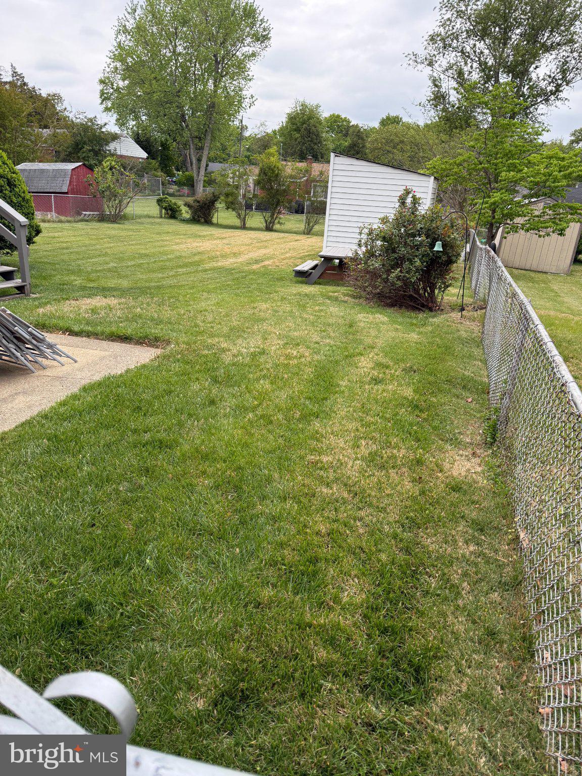 6117 Auth Road Suitland, MD 20746 - Photo 6 of 7 a view of a garden with a building in the background