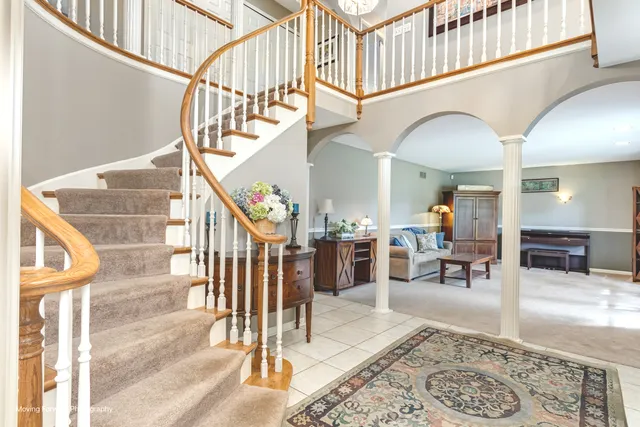 a view of entryway and hall with dining area