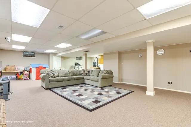 a living room with furniture and car