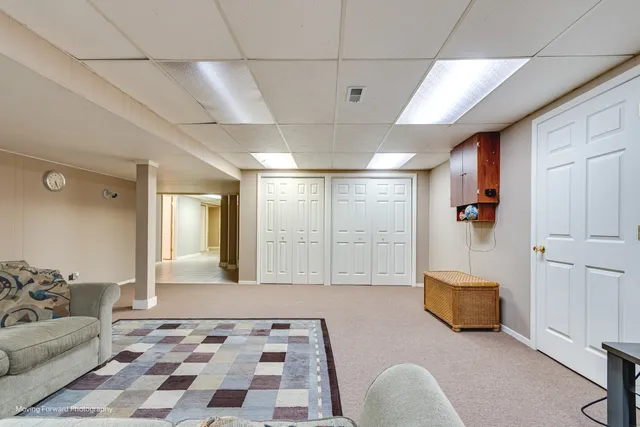 a spacious bedroom with a bed and a couch