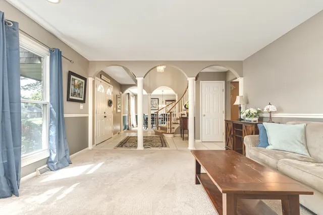 a view of a living room and entryway