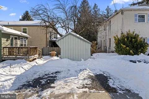 a view of a house with a snow on the road