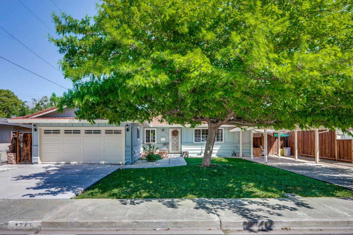 1755 Ravizza Avenue Santa Clara, CA 95051 - Photo 2 of 36 a front view of a house with a yard and potted plants