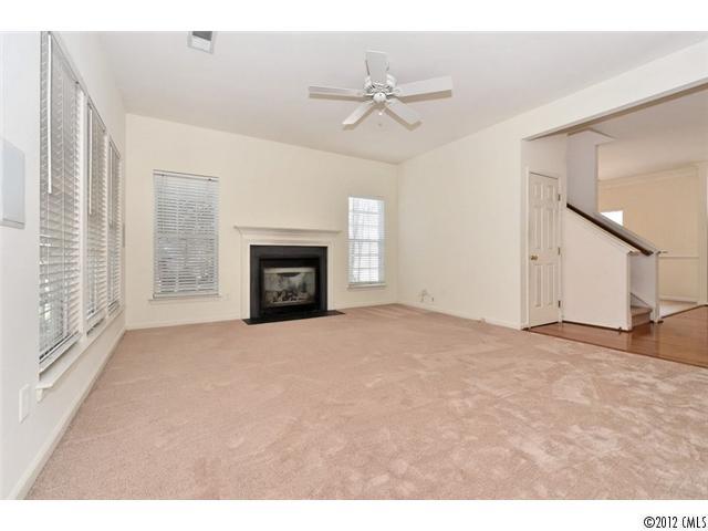 608 Eaton Court Fort Mill, SC 29708 - Photo 13 of 16 a view of an empty room with a fireplace