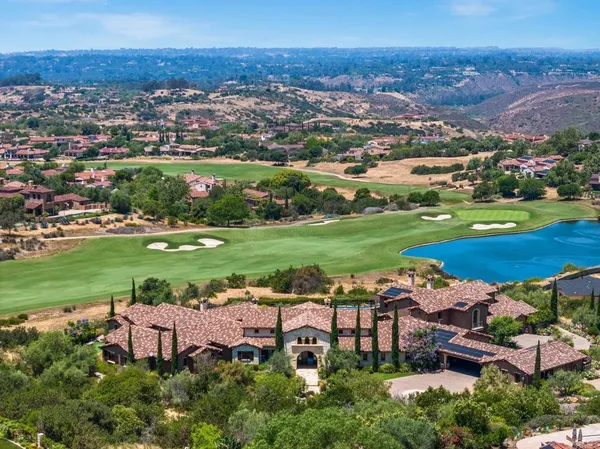 an aerial view of a house with a garden