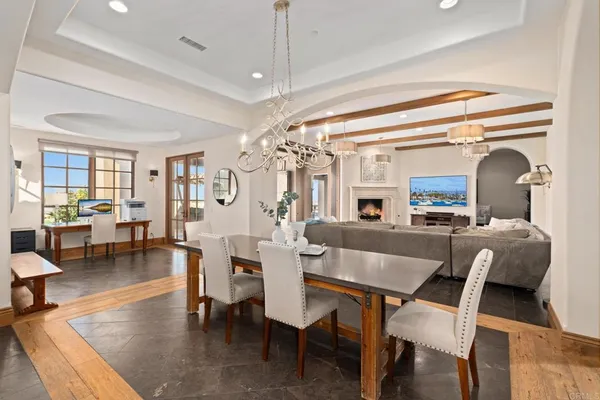 a dining room with wooden floor and breakfast area