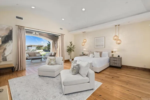 a large en suite bathroom with a glass shower door and a glass door