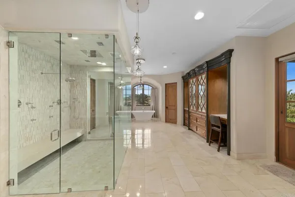 a living room with furniture a fireplace and a table