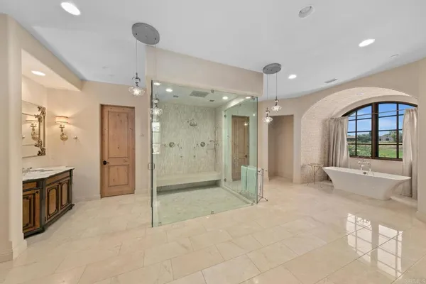 a living room with furniture a rug and a book shelf