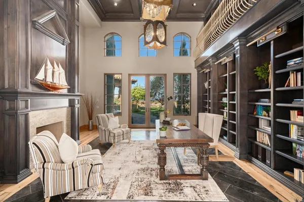 a living room with furniture and a dining table