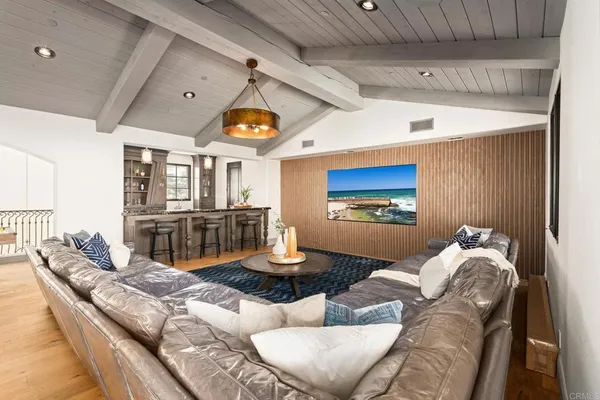 a spacious bathroom with a granite countertop sink and a mirror