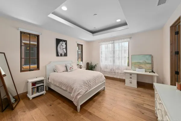 a living room with fireplace furniture and a floor to ceiling window