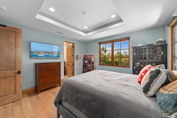 a living room with patio furniture and a floor to ceiling window