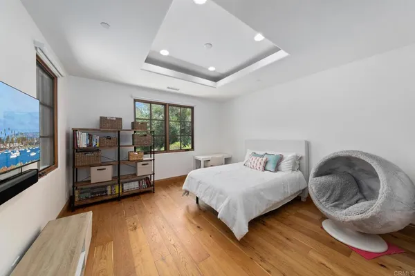 a view of a patio with table and chairs a barbeque with wooden floor and roof