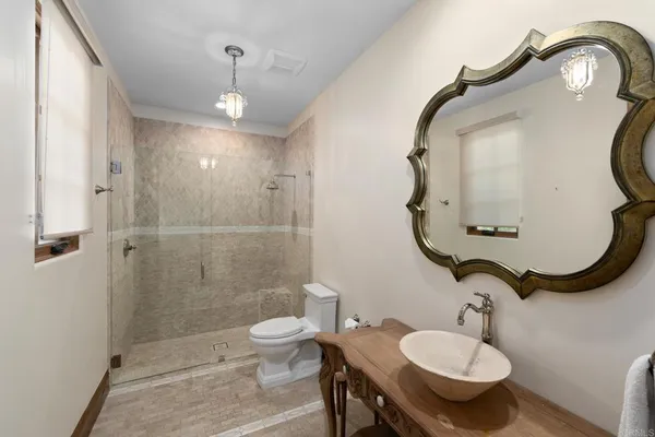 a view of a patio with chairs and potted plants
