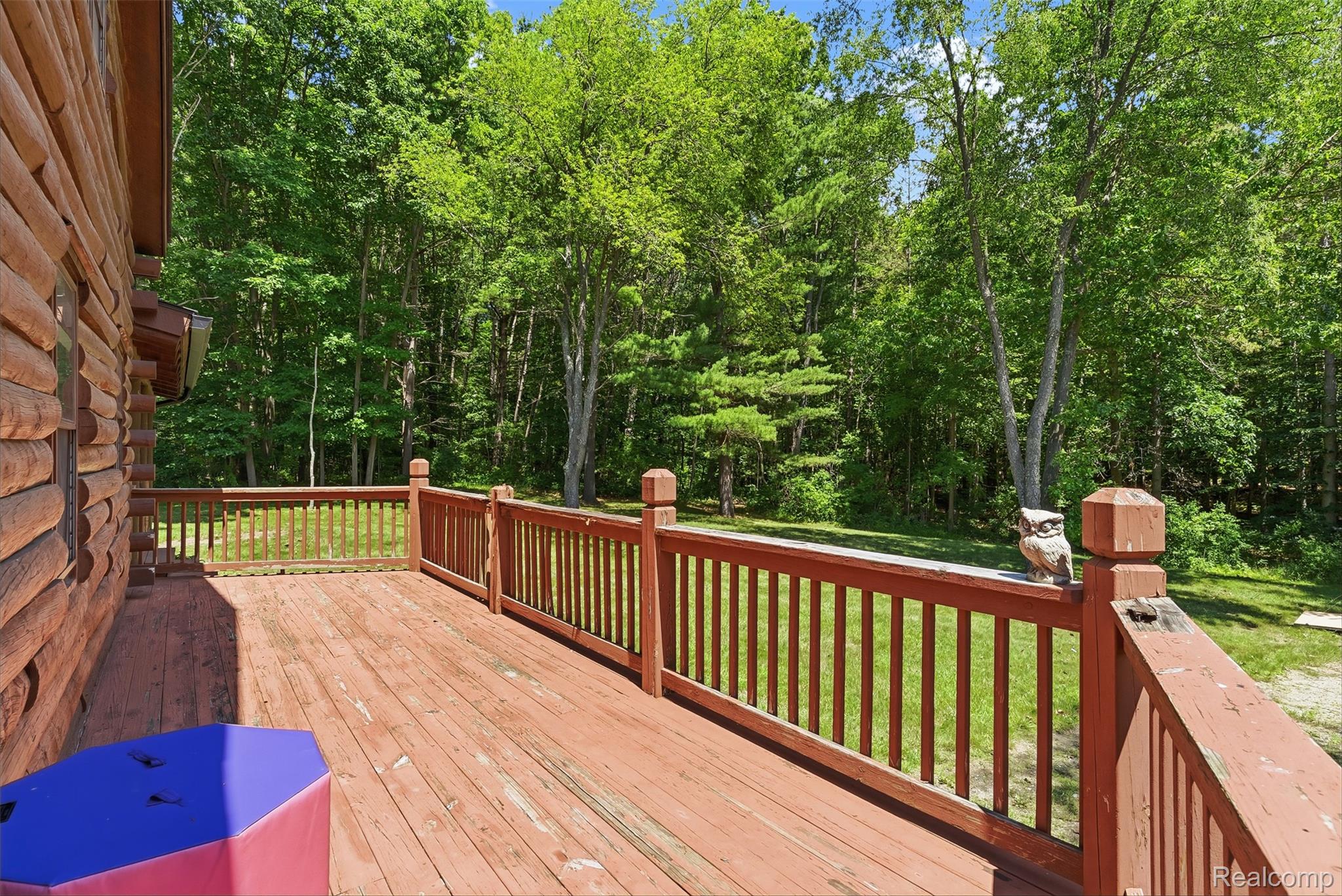 3656 Stanley Road Columbiaville, MI 48421 - Photo 43 of 65 Expansive exterior deck featuring wood railing and a natural wood-finish surface