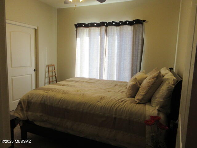 511 Camino Hombre De Oro Rio Rico, AZ 85648 - Photo 43 of 44 a bed sitting in a bedroom next to a window