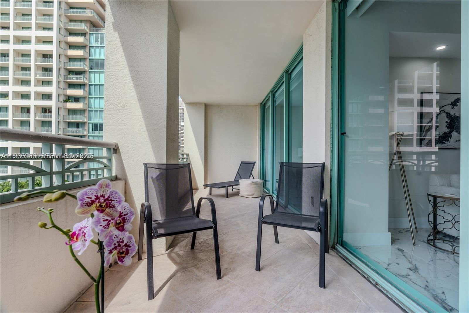 3400 Southwest 27th Avenue, Unit 605 Miami, FL 33133 - Photo 21 of 34 a view of a hallway with seating area