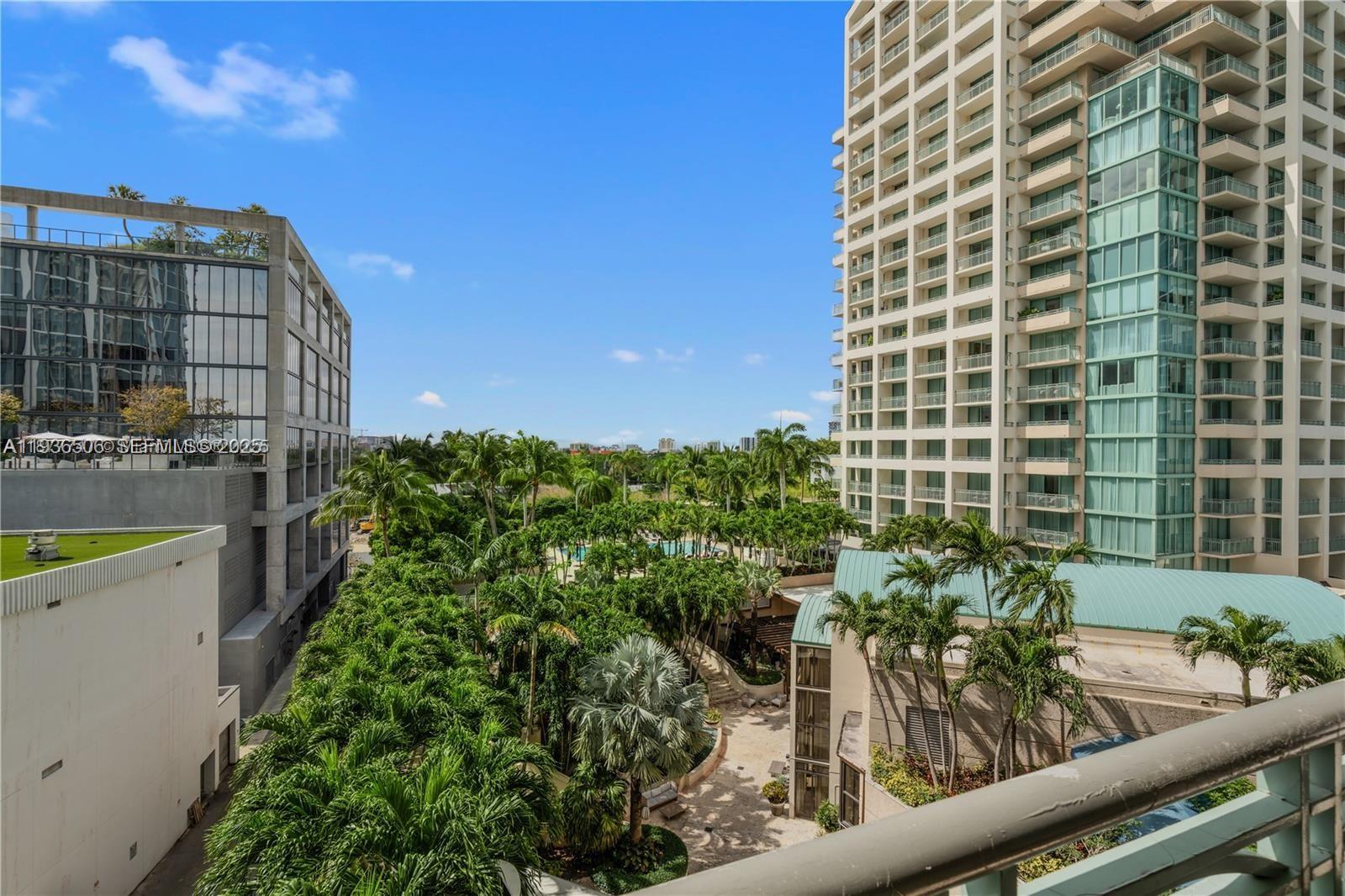 3400 Southwest 27th Avenue, Unit 605 Miami, FL 33133 - Photo 23 of 34 a view of a tall building from a balcony