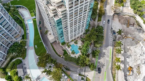 an aerial view of a residential apartment building with plants